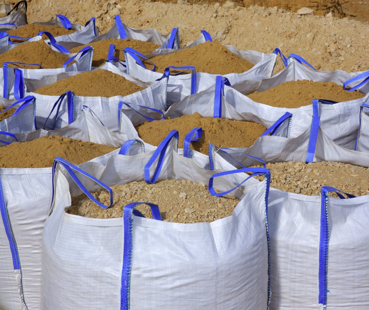 a collection of sand-filled totes